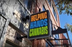 Helping hands cannabis signage